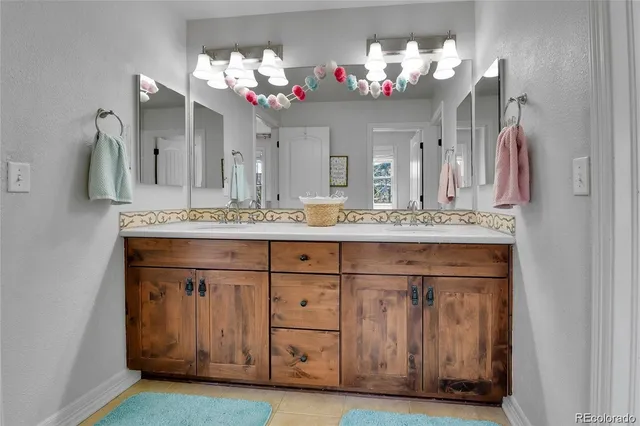 a bathroom with a sink vanity and a mirror