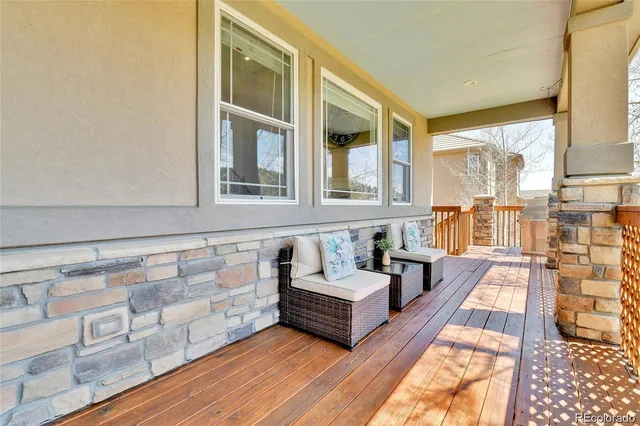 a spacious bedroom with furniture and a large window