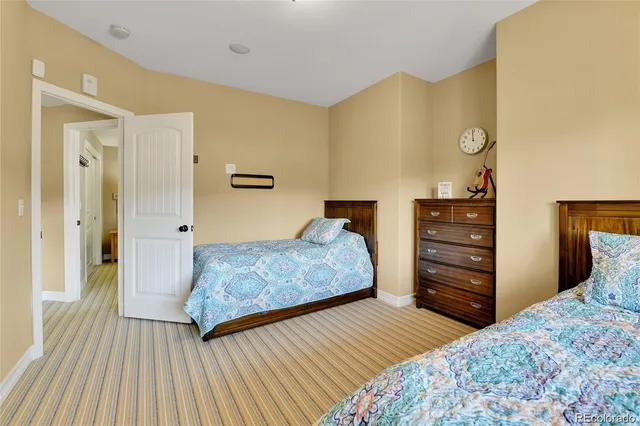 a bedroom with a bed and cabinets