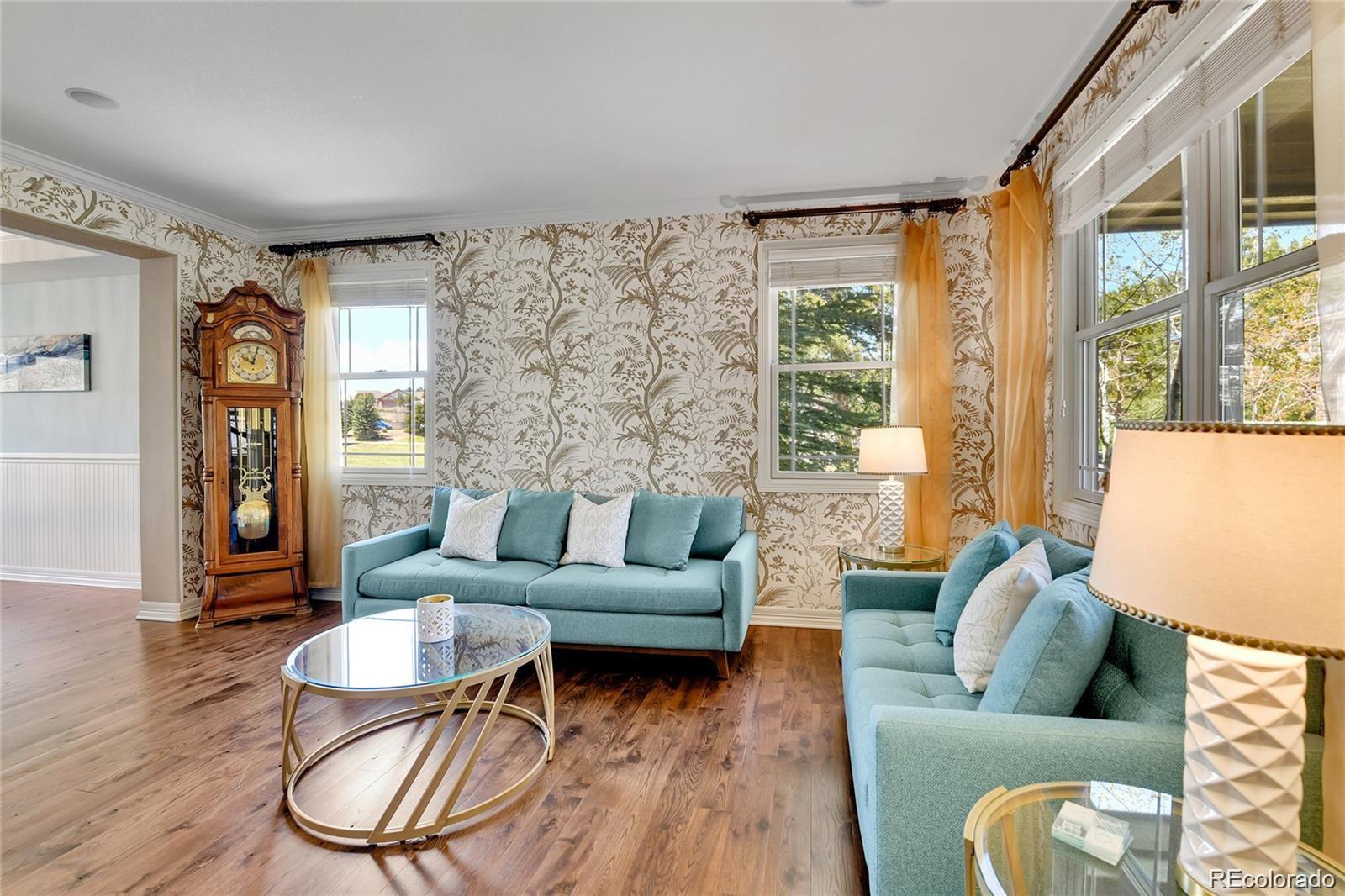 791 Elk Rest Road Evergreen, CO 80439 - Photo 5 of 39 a living room with furniture and a large window