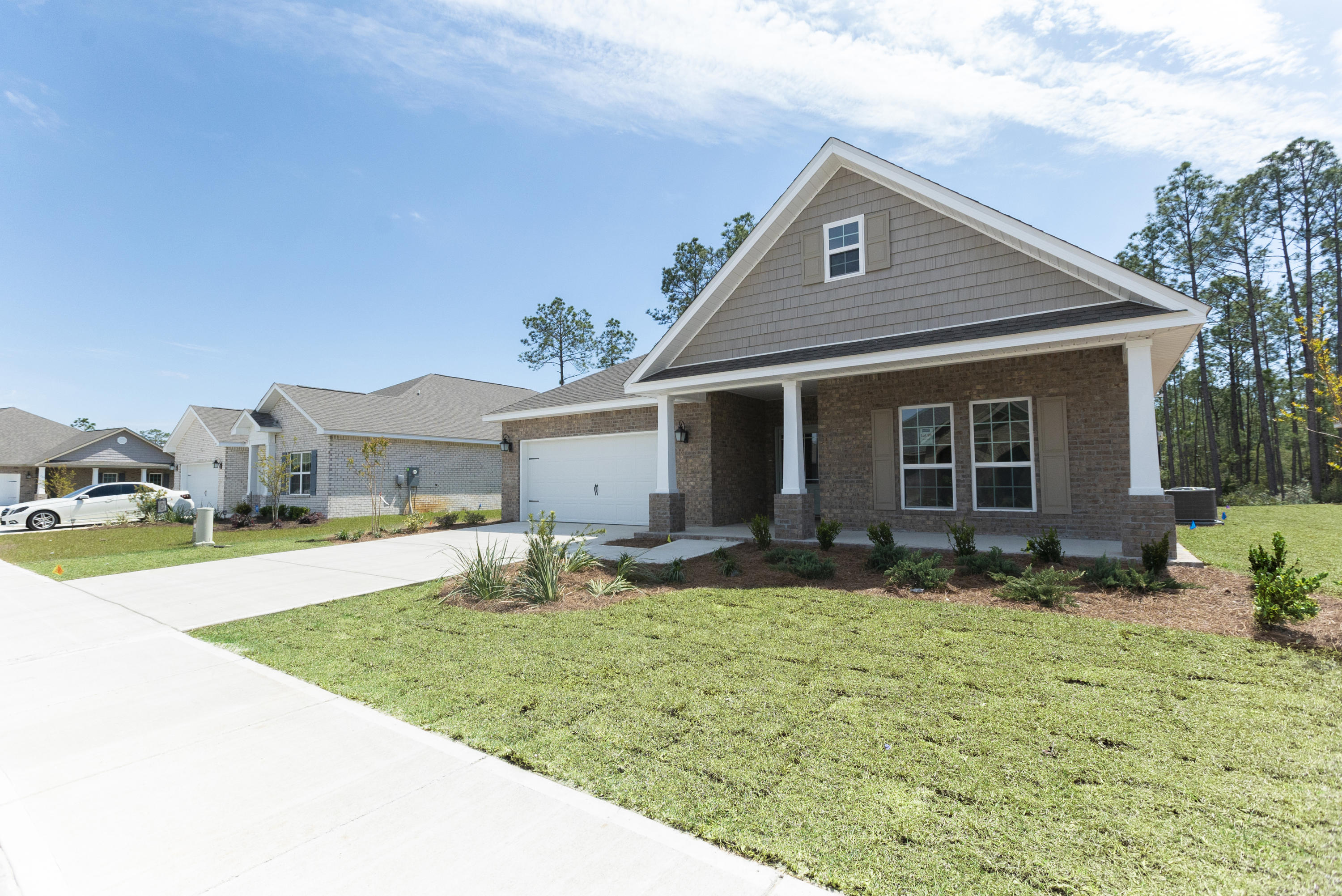 385 Wayne Trail Santa Rosa Beach, FL 32459 - Photo 1 of 39 a front view of house with yard and seating area