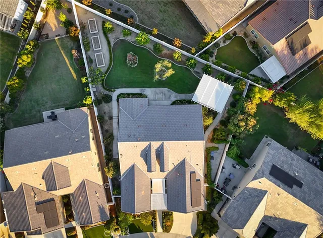 an aerial view of a house with a swimming pool