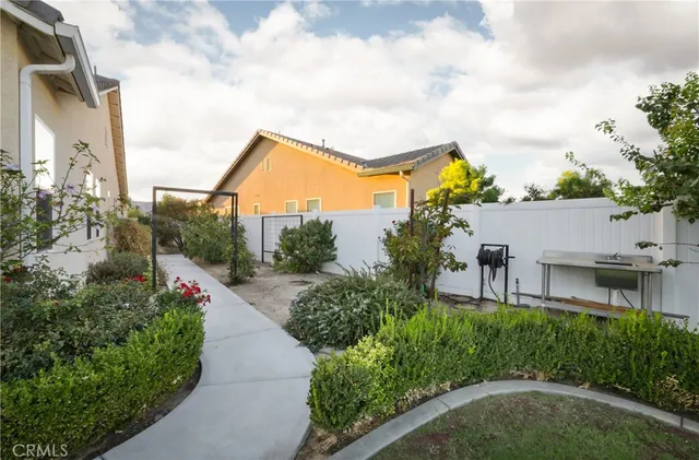 an aerial view of house with yard