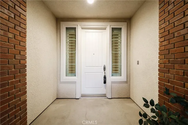 a view of a livingroom with an empty space and a window