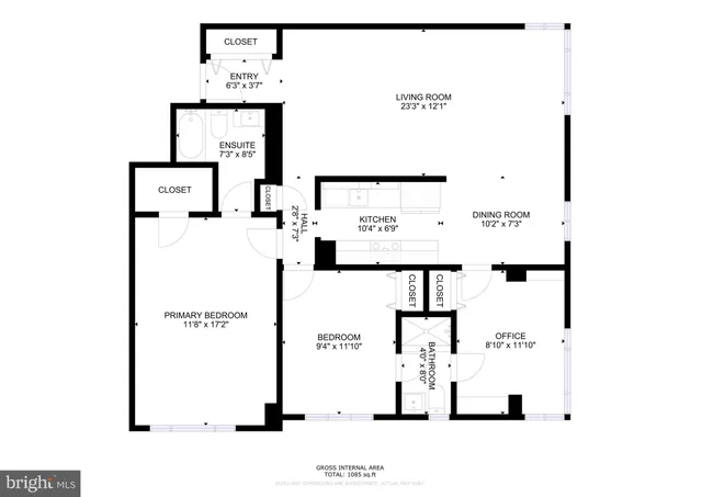 a living room with furniture fireplace and a large window