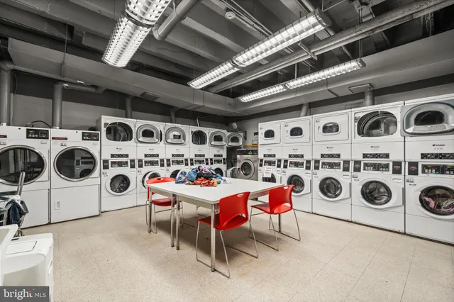 a view of a hallway with wooden shelves