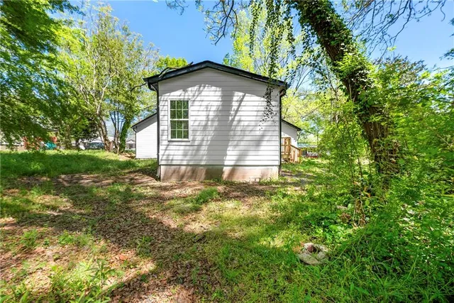 a view of a house with a small yard