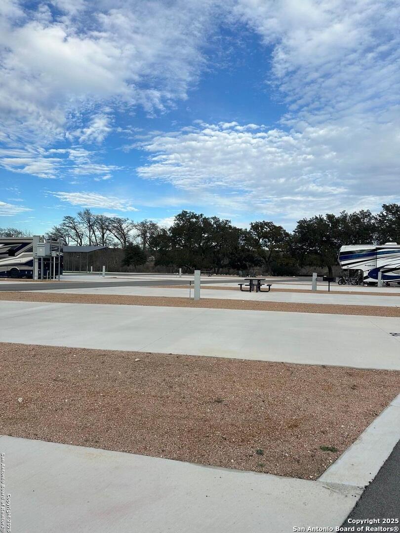 4300 Highway 16, Unit 29 Bandera, TX 78003 - Photo 3 of 10 a view of a swimming pool and an outdoor seating