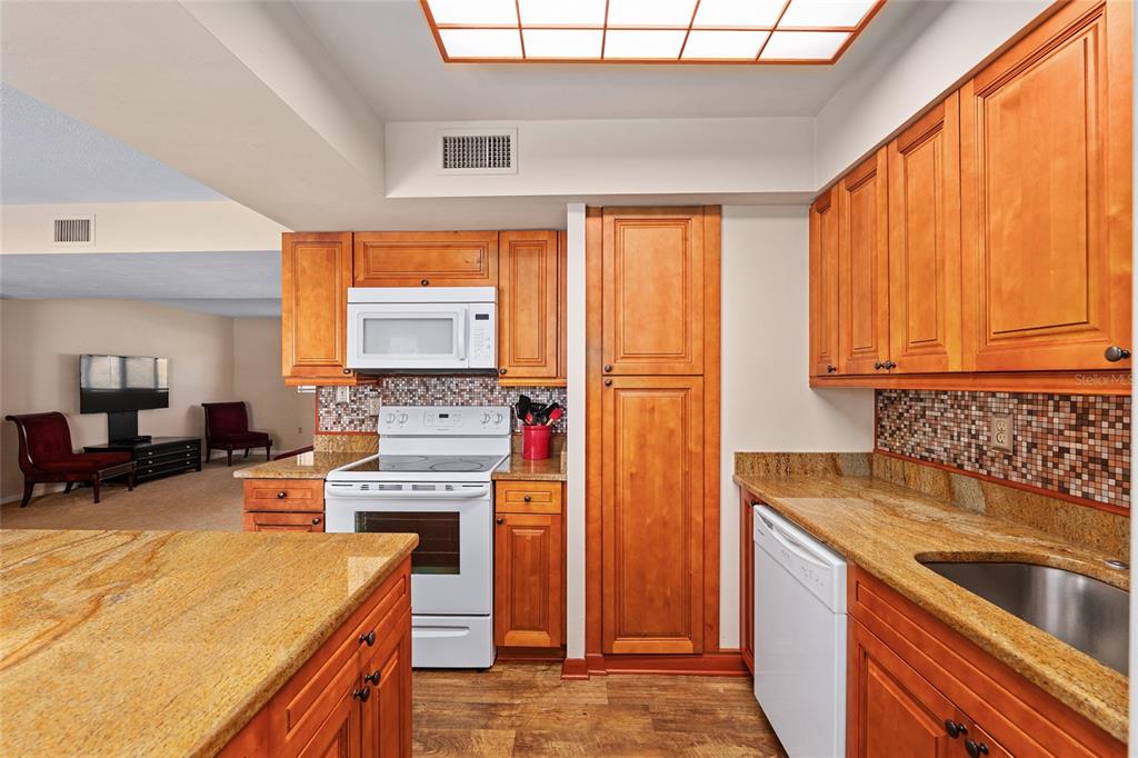 401 Northwest 39th Road, Unit 401C Gainesville, FL 32607 - Photo 14 of 62 a kitchen with a stove a sink and a refrigerator