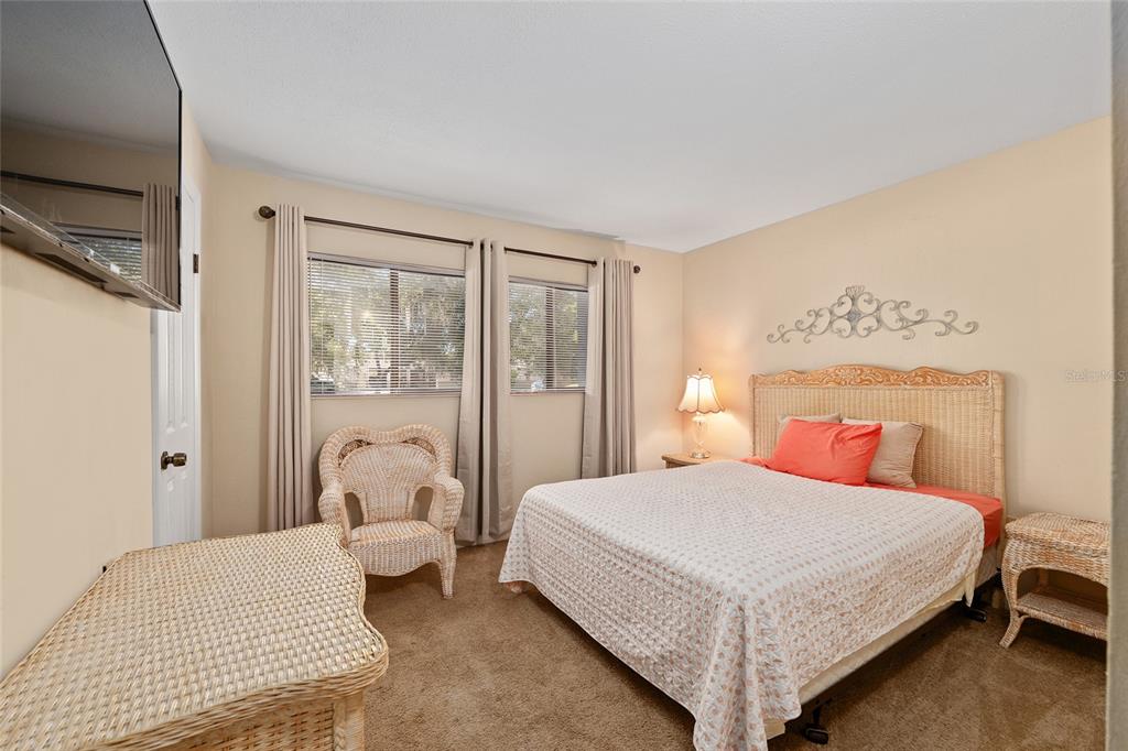 401 Northwest 39th Road, Unit 401C Gainesville, FL 32607 - Photo 22 of 62 a bedroom with a bed and a large window