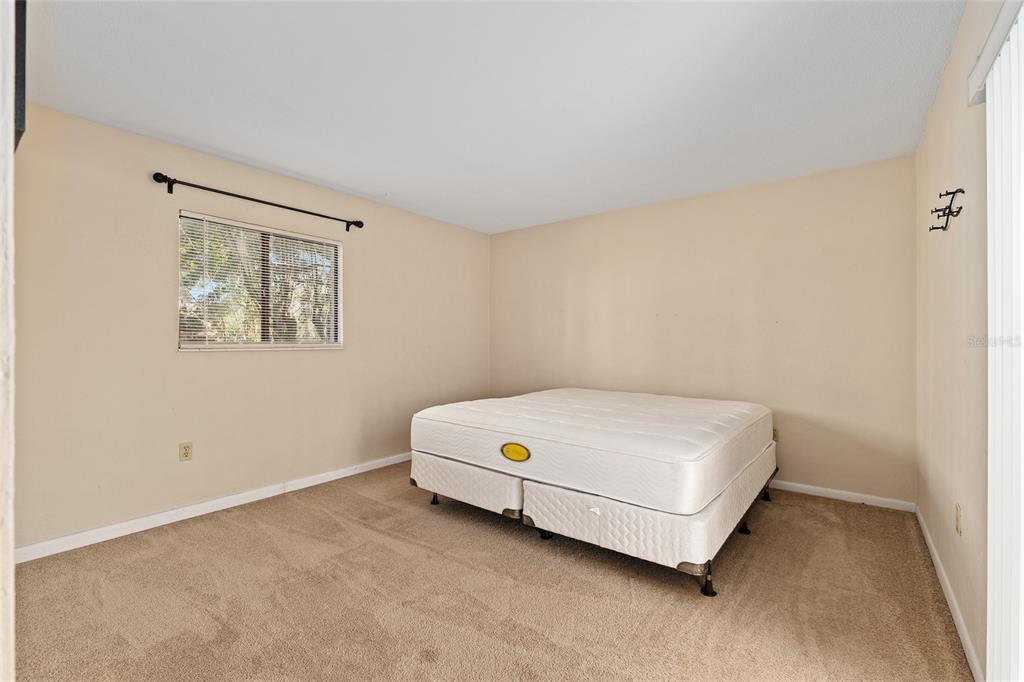 401 Northwest 39th Road, Unit 401C Gainesville, FL 32607 - Photo 26 of 62 a utility room with a bed
