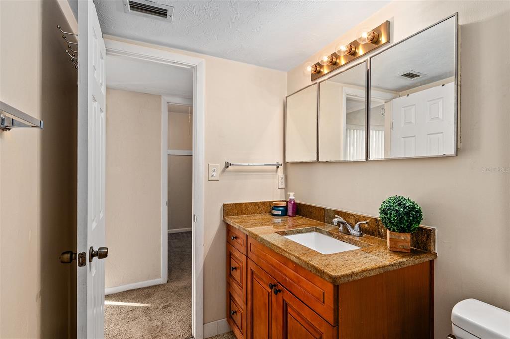 401 Northwest 39th Road, Unit 401C Gainesville, FL 32607 - Photo 31 of 62 a bathroom with a sink and mirror