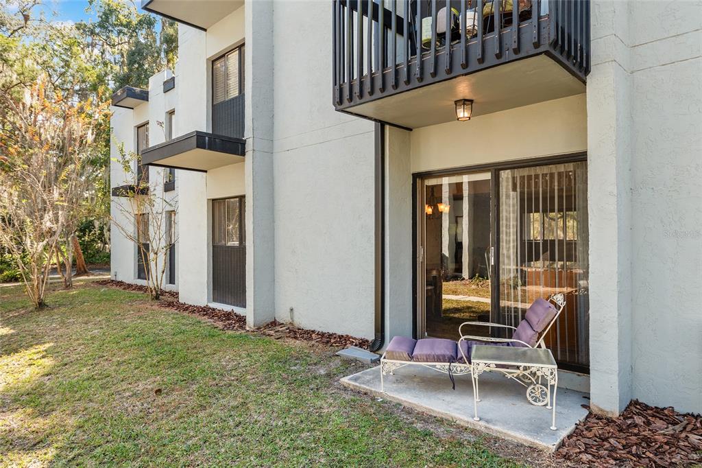 401 Northwest 39th Road, Unit 401C Gainesville, FL 32607 - Photo 37 of 62 a view of a patio with chair and tables