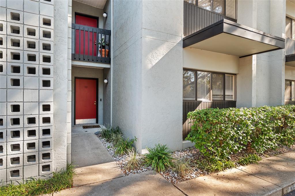 401 Northwest 39th Road, Unit 401C Gainesville, FL 32607 - Photo 51 of 62 a front view of a house with a yard