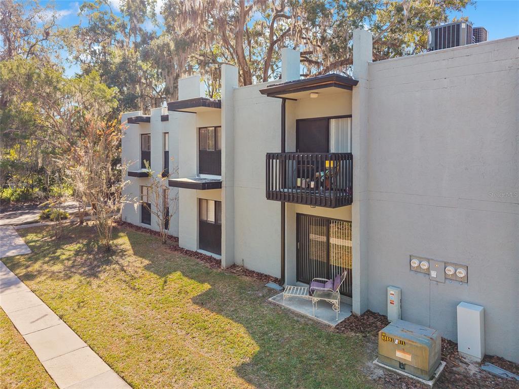 401 Northwest 39th Road, Unit 401C Gainesville, FL 32607 - Photo 53 of 62 a front view of a house with a yard