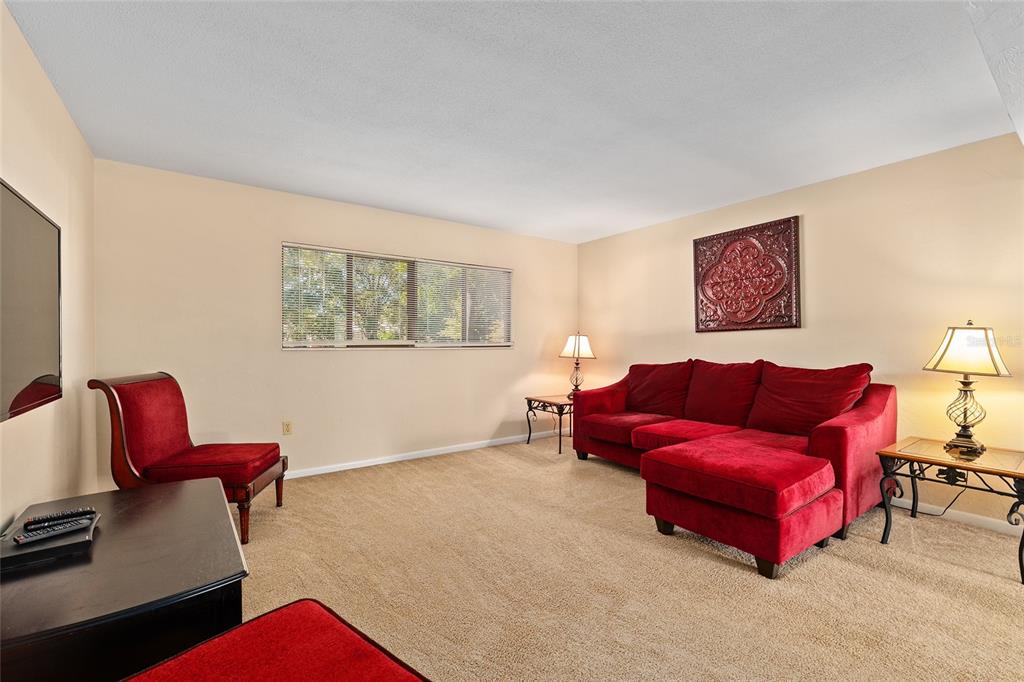 401 Northwest 39th Road, Unit 401C Gainesville, FL 32607 - Photo 6 of 62 a living room with furniture and a window