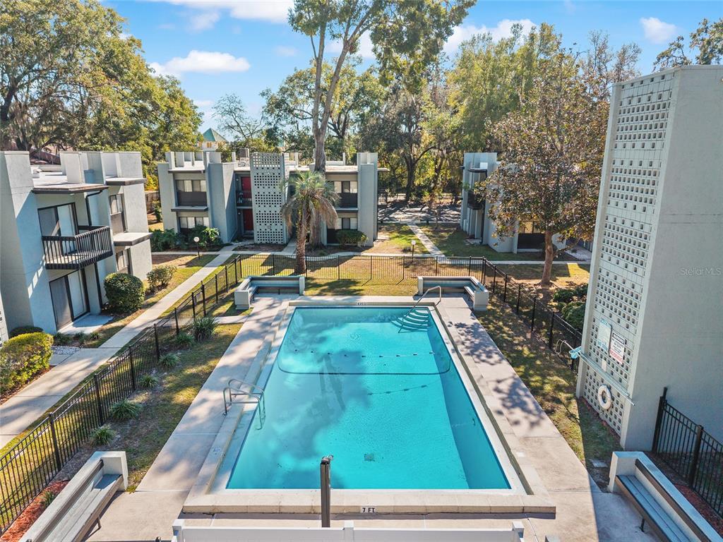 401 Northwest 39th Road, Unit 401C Gainesville, FL 32607 - Photo 61 of 62 a view of swimming pool with a lounge chairs
