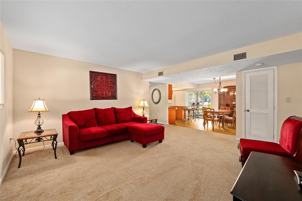 401 Northwest 39th Road, Unit 401C Gainesville, FL 32607 - Photo 7 of 62 a living room with furniture and a lamp