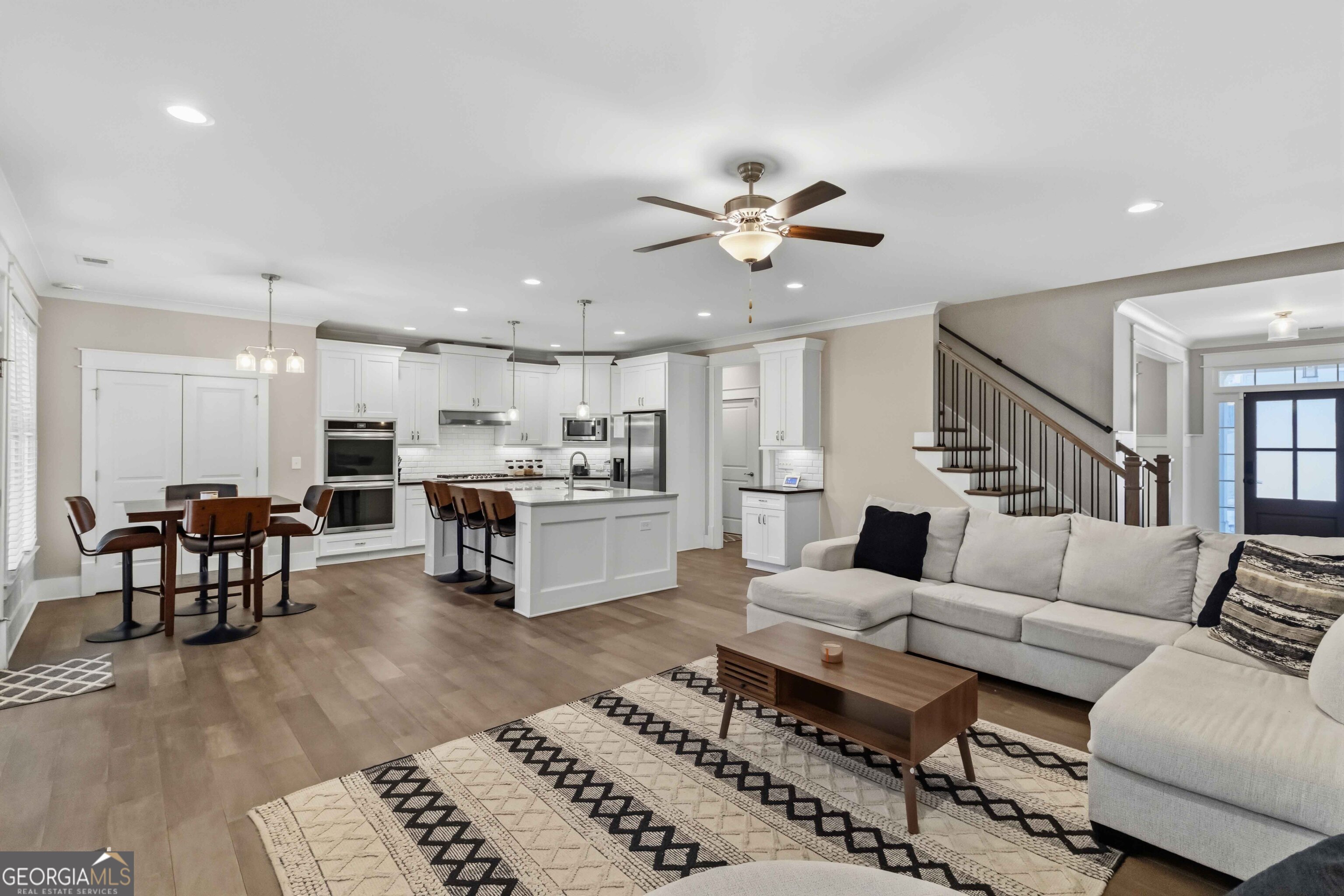 6247 Allen Ivey Road Mableton, GA 30126 - Photo 11 of 31 a living room with furniture kitchen view and a dining table