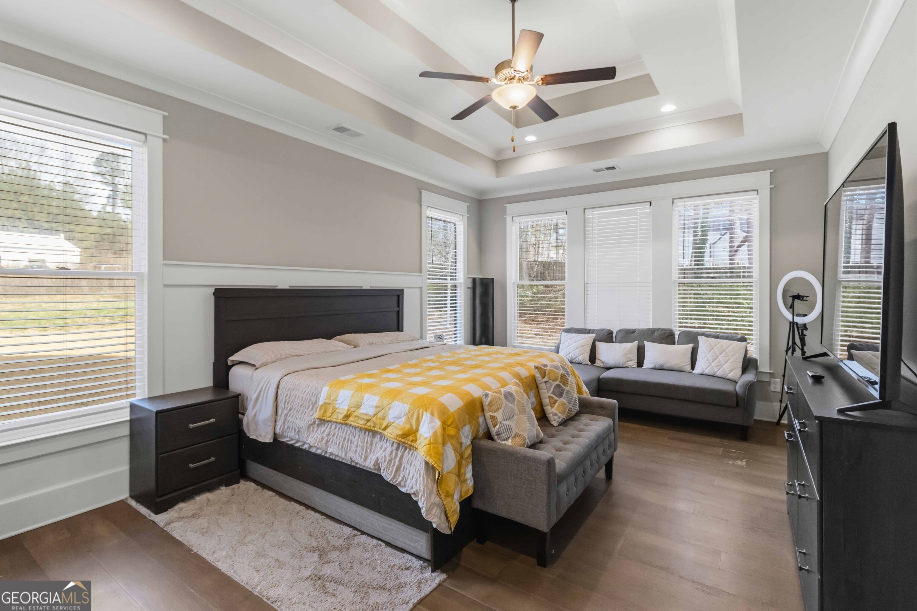 6247 Allen Ivey Road Mableton, GA 30126 - Photo 14 of 31 a bedroom with a bed and a chandelier