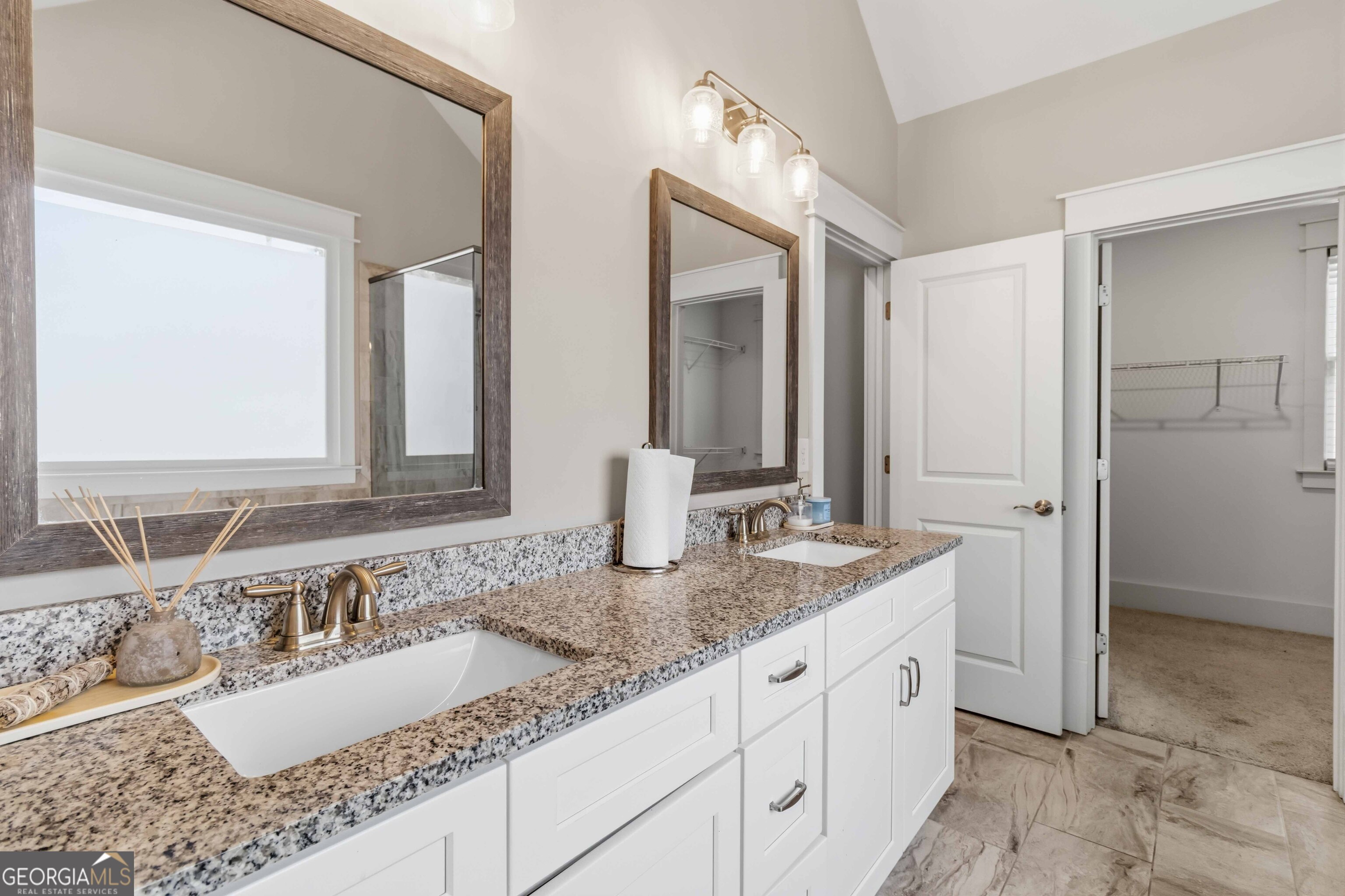 6247 Allen Ivey Road Mableton, GA 30126 - Photo 15 of 31 a bathroom with a granite countertop sink and a mirror