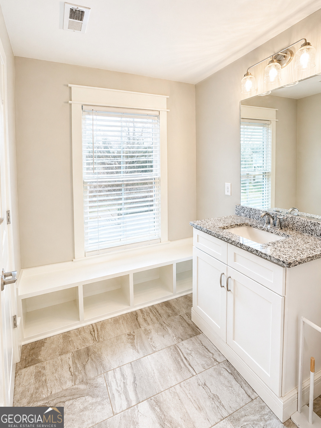 6247 Allen Ivey Road Mableton, GA 30126 - Photo 21 of 31 a bathroom with a granite countertop sink and a bathtub