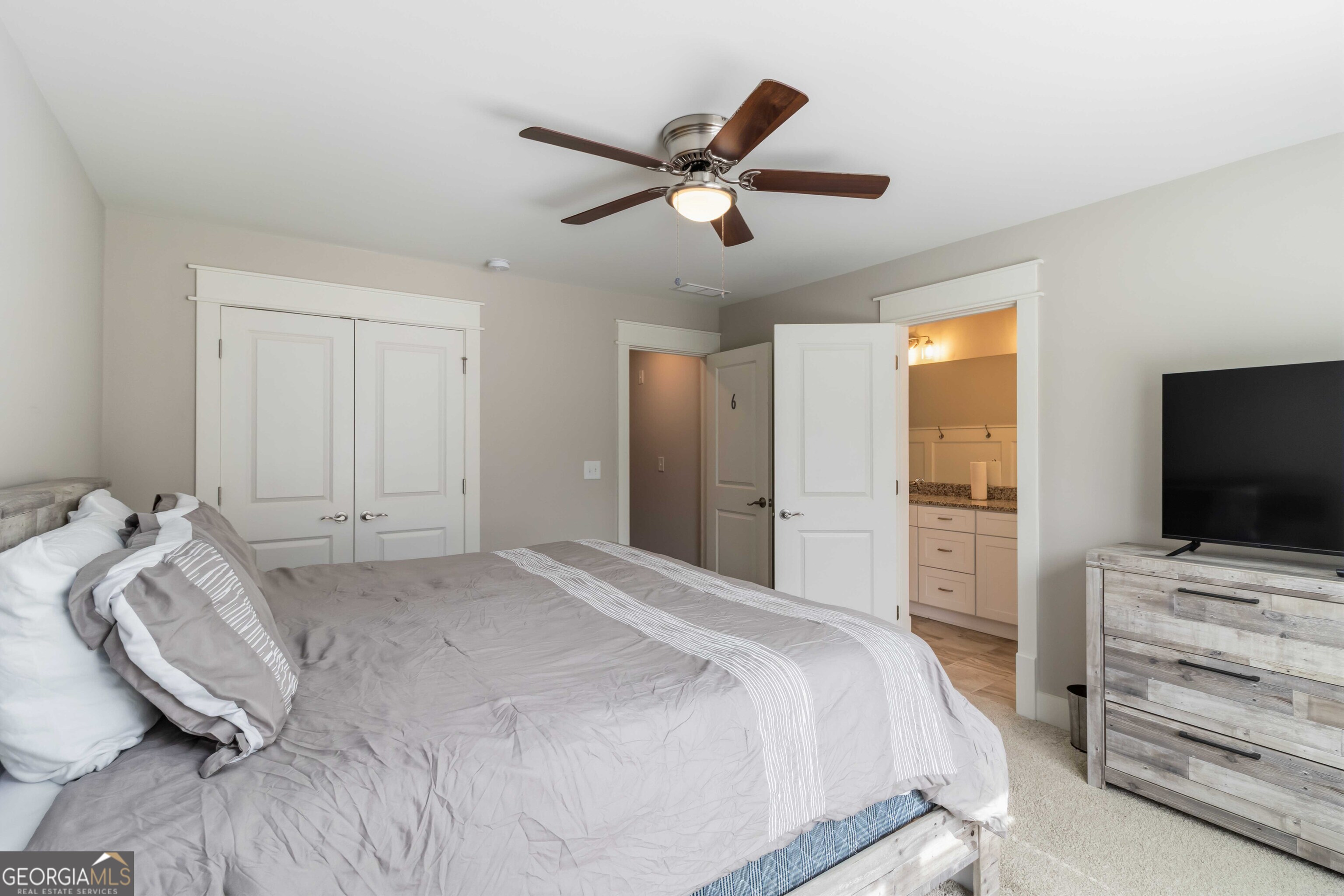 6247 Allen Ivey Road Mableton, GA 30126 - Photo 23 of 31 a bedroom with a bed and a flat screen tv
