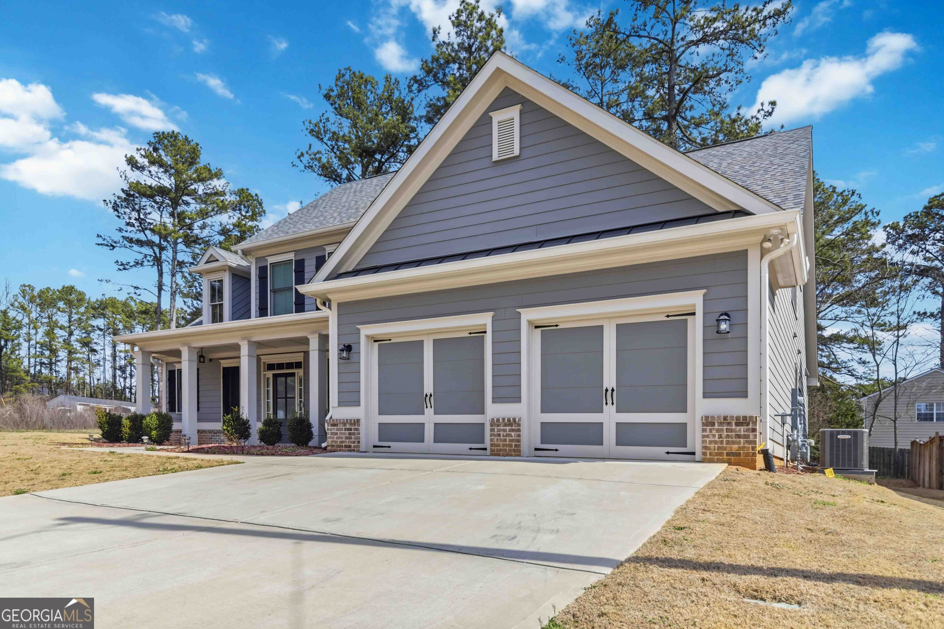 6247 Allen Ivey Road Mableton, GA 30126 - Photo 3 of 31 a view of a house with a large windows and flower plants