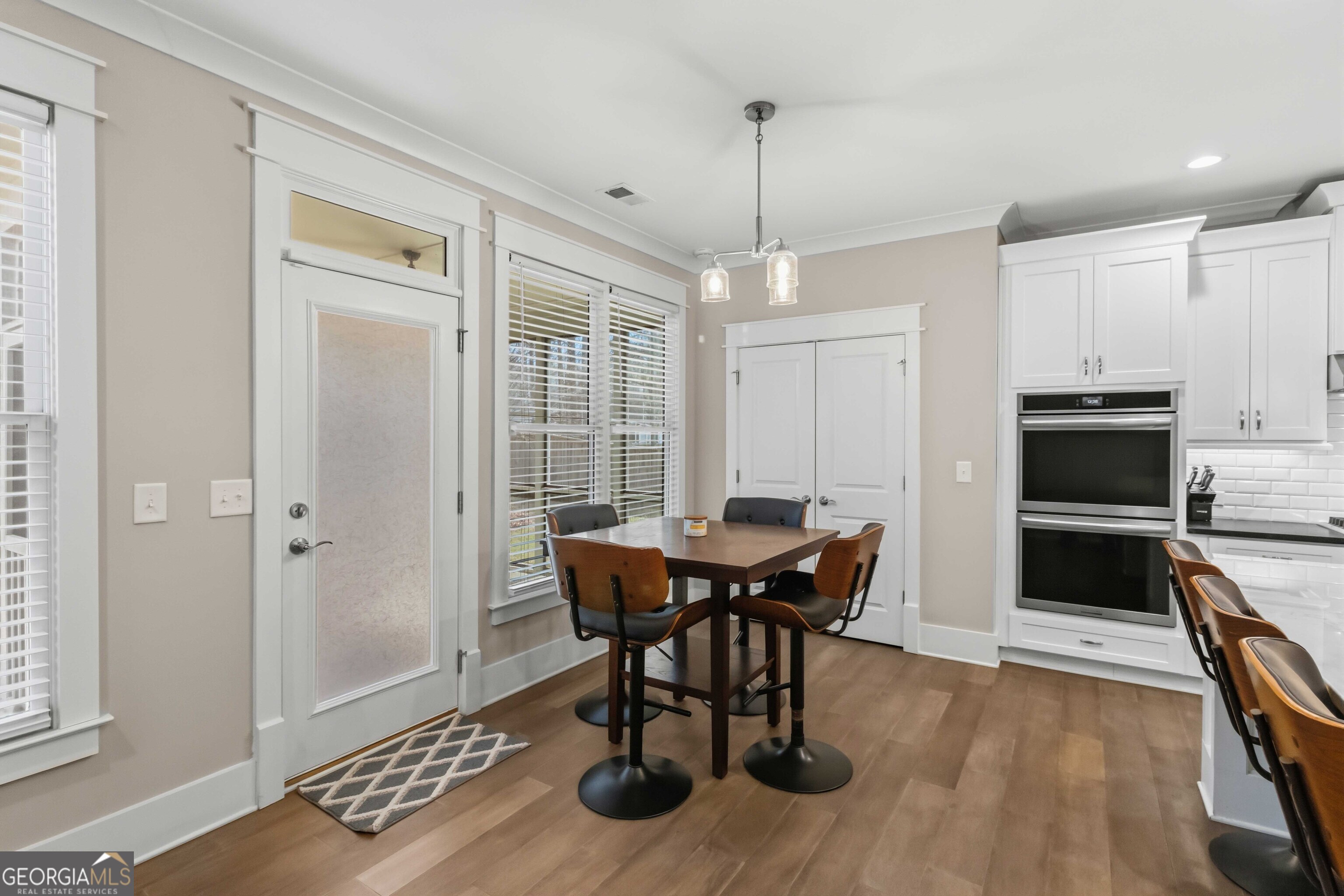 6247 Allen Ivey Road Mableton, GA 30126 - Photo 10 of 31 a view of a dining room with furniture window and wooden floor