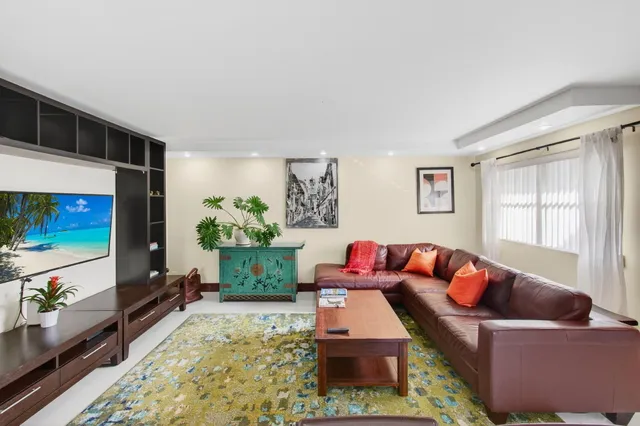 a bedroom with a large bed and a large window