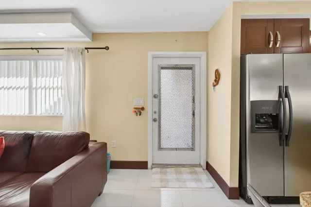 a living room with a couch and a window