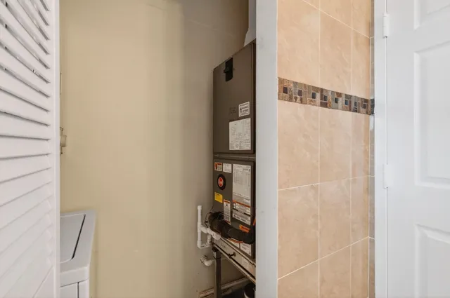 a front view of a house with a garden and plants