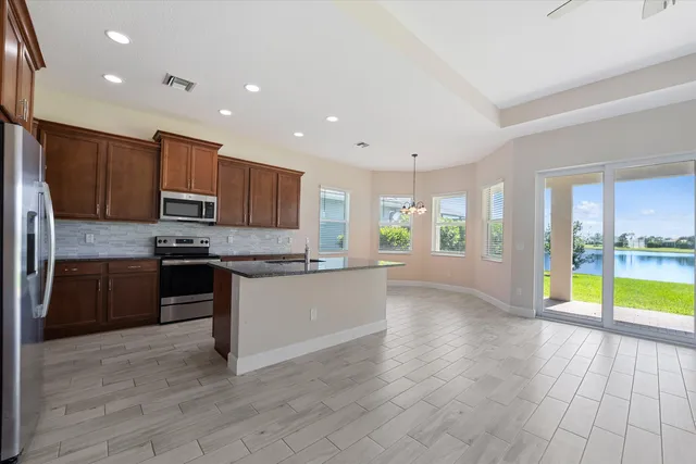 a view of kitchen with cabinets and wooden floor
