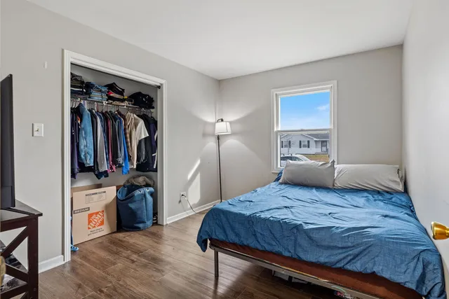 a bedroom with a bed and a closet