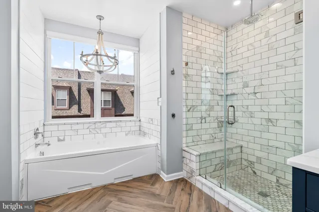 a bathroom with a bathtub and shower