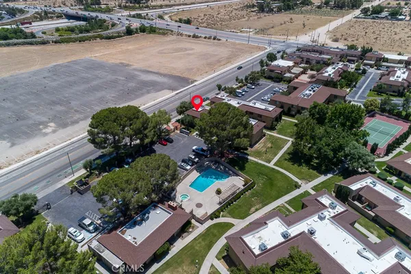 an aerial view of a house with a garden