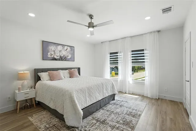 a bedroom with a large bed and a window