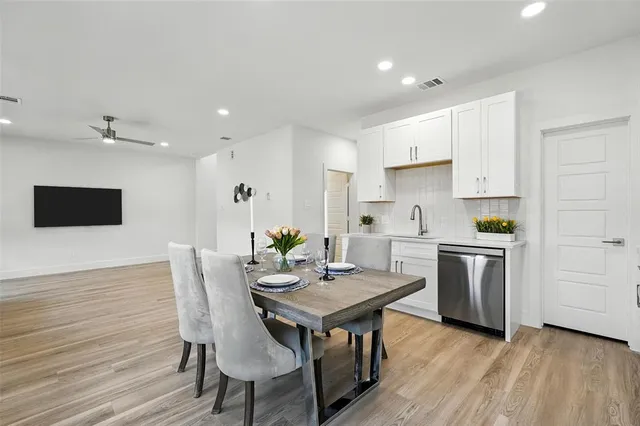 a kitchen with a table and chairs in it
