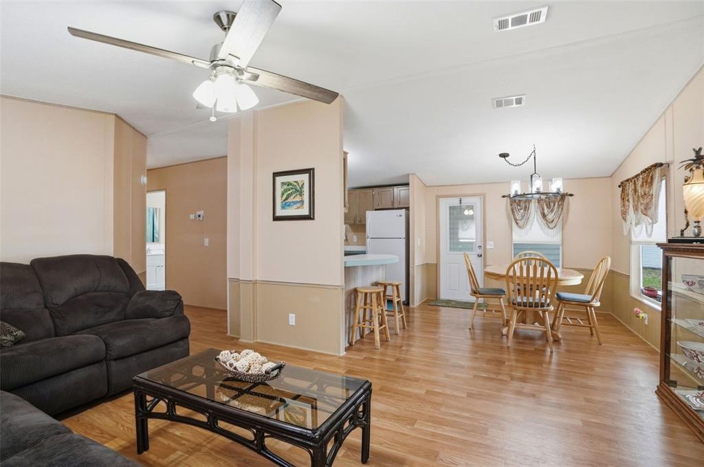 5161 Forest Glenn Drive Spring Hill, FL 34607 - Photo 11 of 51 a living room with furniture and wooden floor