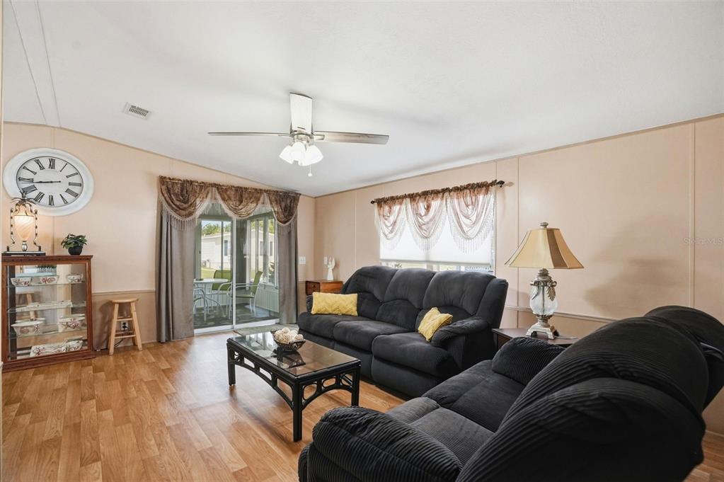 5161 Forest Glenn Drive Spring Hill, FL 34607 - Photo 12 of 51 a living room with furniture and wooden floor