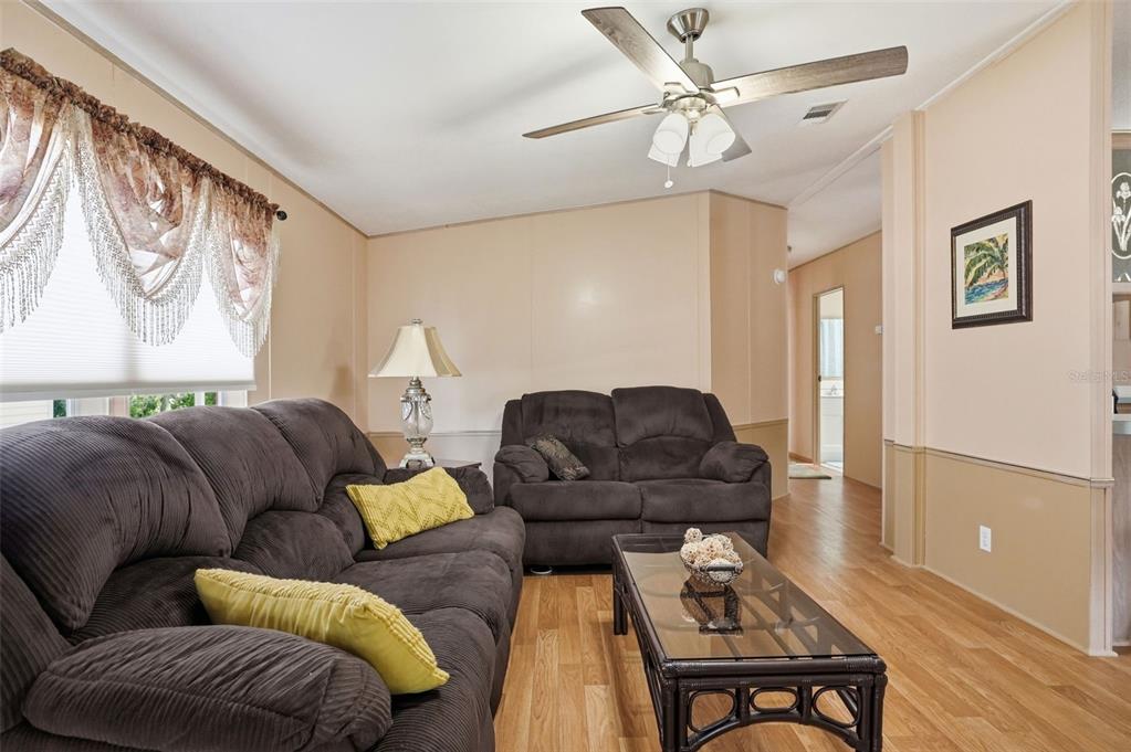 5161 Forest Glenn Drive Spring Hill, FL 34607 - Photo 15 of 51 a living room with furniture and a rug