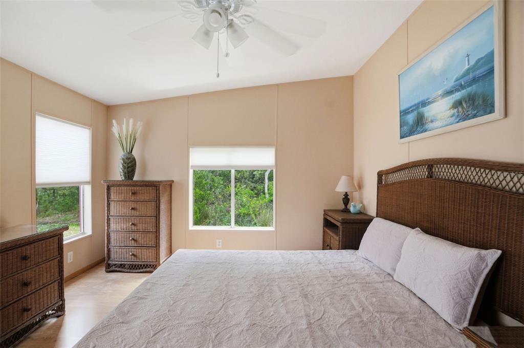 5161 Forest Glenn Drive Spring Hill, FL 34607 - Photo 17 of 51 a bedroom with a bed and a window