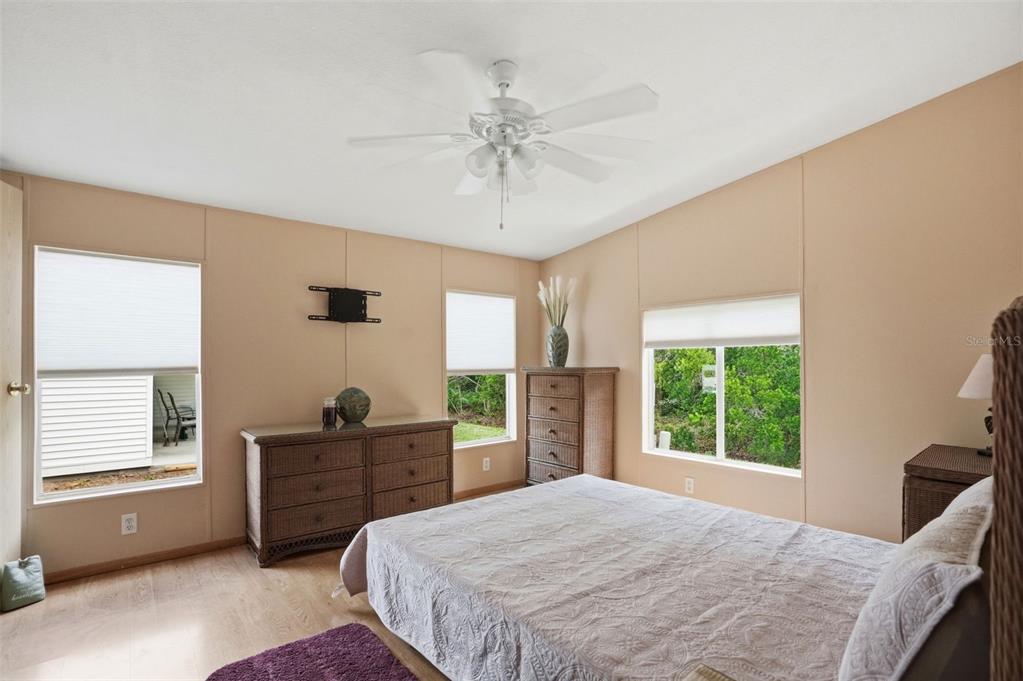 5161 Forest Glenn Drive Spring Hill, FL 34607 - Photo 18 of 51 a bedroom with a bed dresser and a window
