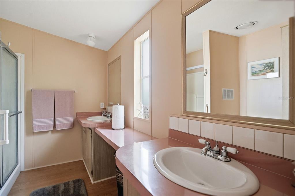 5161 Forest Glenn Drive Spring Hill, FL 34607 - Photo 22 of 51 a bathroom with a sink and a mirror