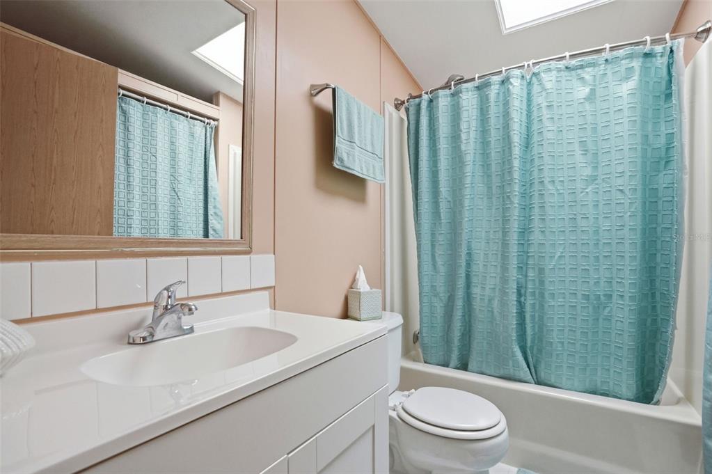 5161 Forest Glenn Drive Spring Hill, FL 34607 - Photo 27 of 51 a bathroom with a sink a toilet and shower