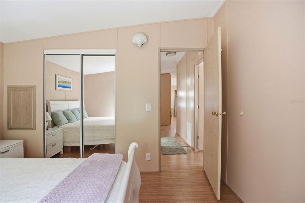 5161 Forest Glenn Drive Spring Hill, FL 34607 - Photo 28 of 51 a bedroom with a bed and a mirror