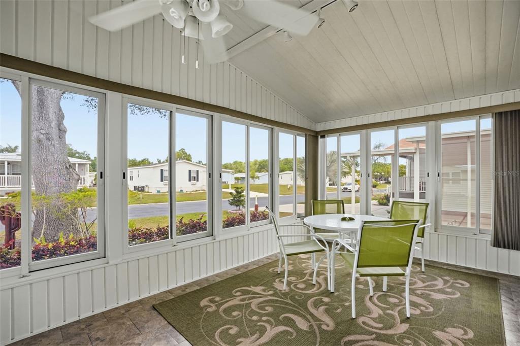 5161 Forest Glenn Drive Spring Hill, FL 34607 - Photo 33 of 51 a living room with furniture and a large window