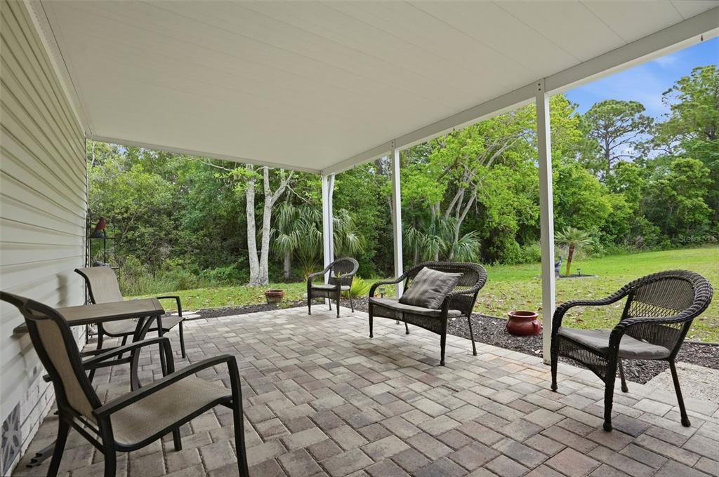5161 Forest Glenn Drive Spring Hill, FL 34607 - Photo 34 of 51 a view of chairs and tables in the patio