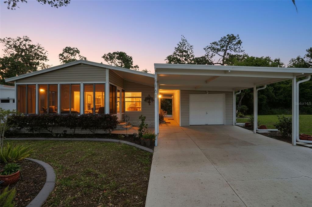5161 Forest Glenn Drive Spring Hill, FL 34607 - Photo 43 of 51 a view of a house with a porch