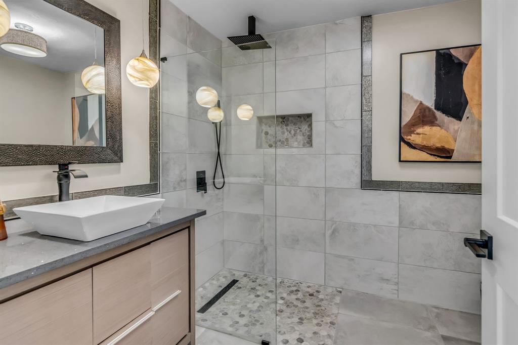 3449 West T Parr Road Grapevine, TX 76051 - Photo 22 of 32 a bathroom with a sink and mirror
